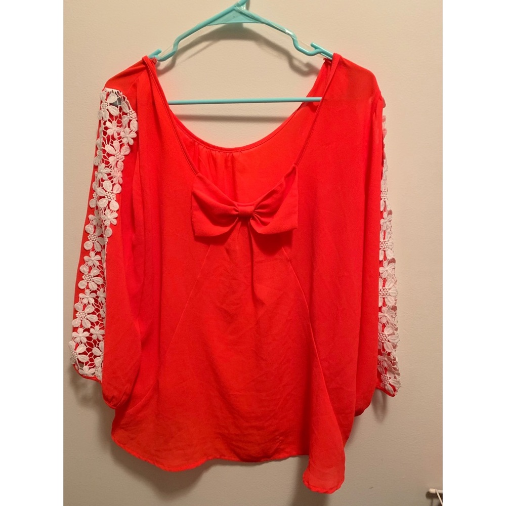 Blouse with bow and lace pattern sleeves